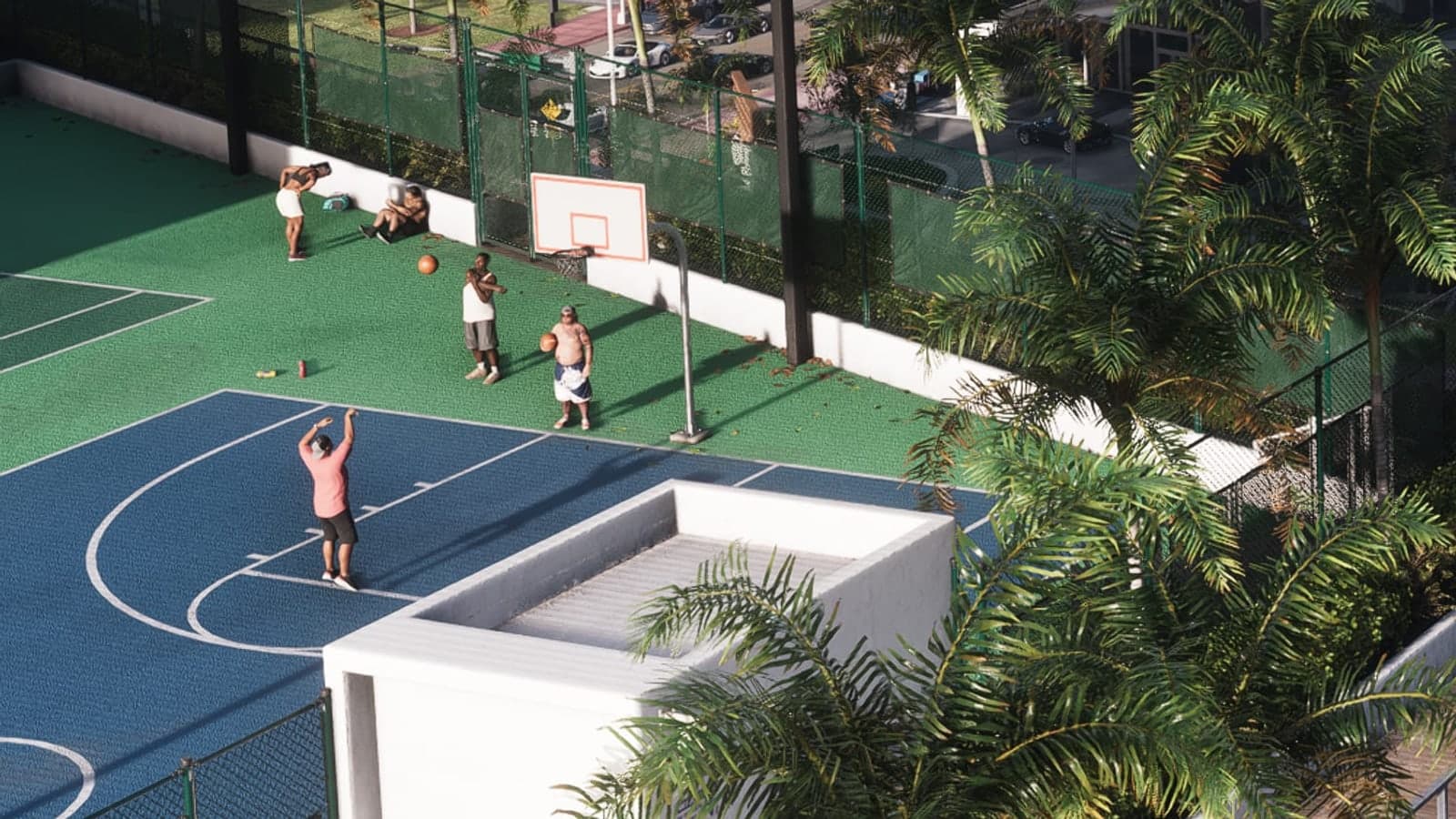 People play basketball on outdoor courts in Vice City, seen from above