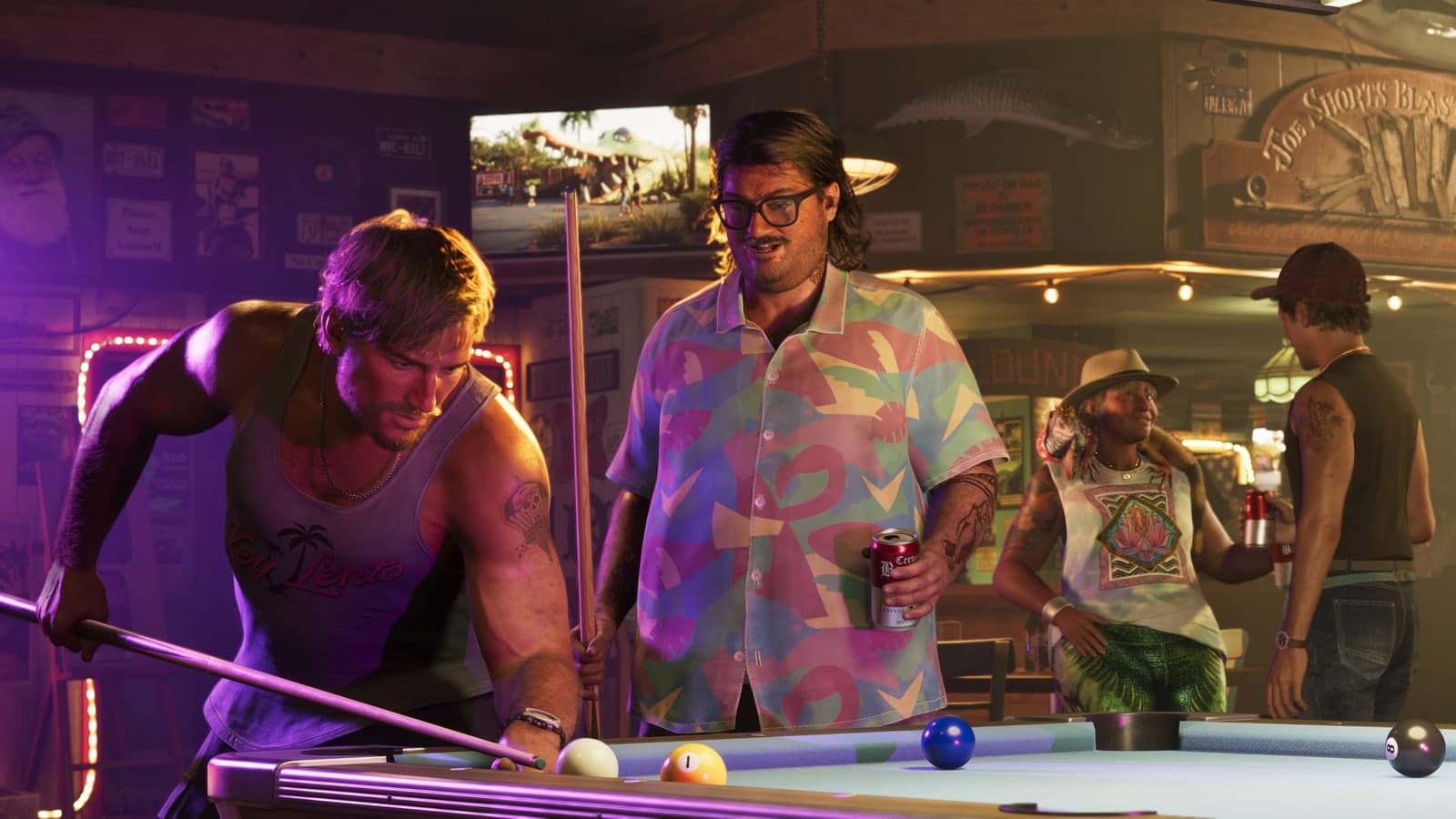 A man lines up a shot at a bar pool table as Cal Hampton and friends look on