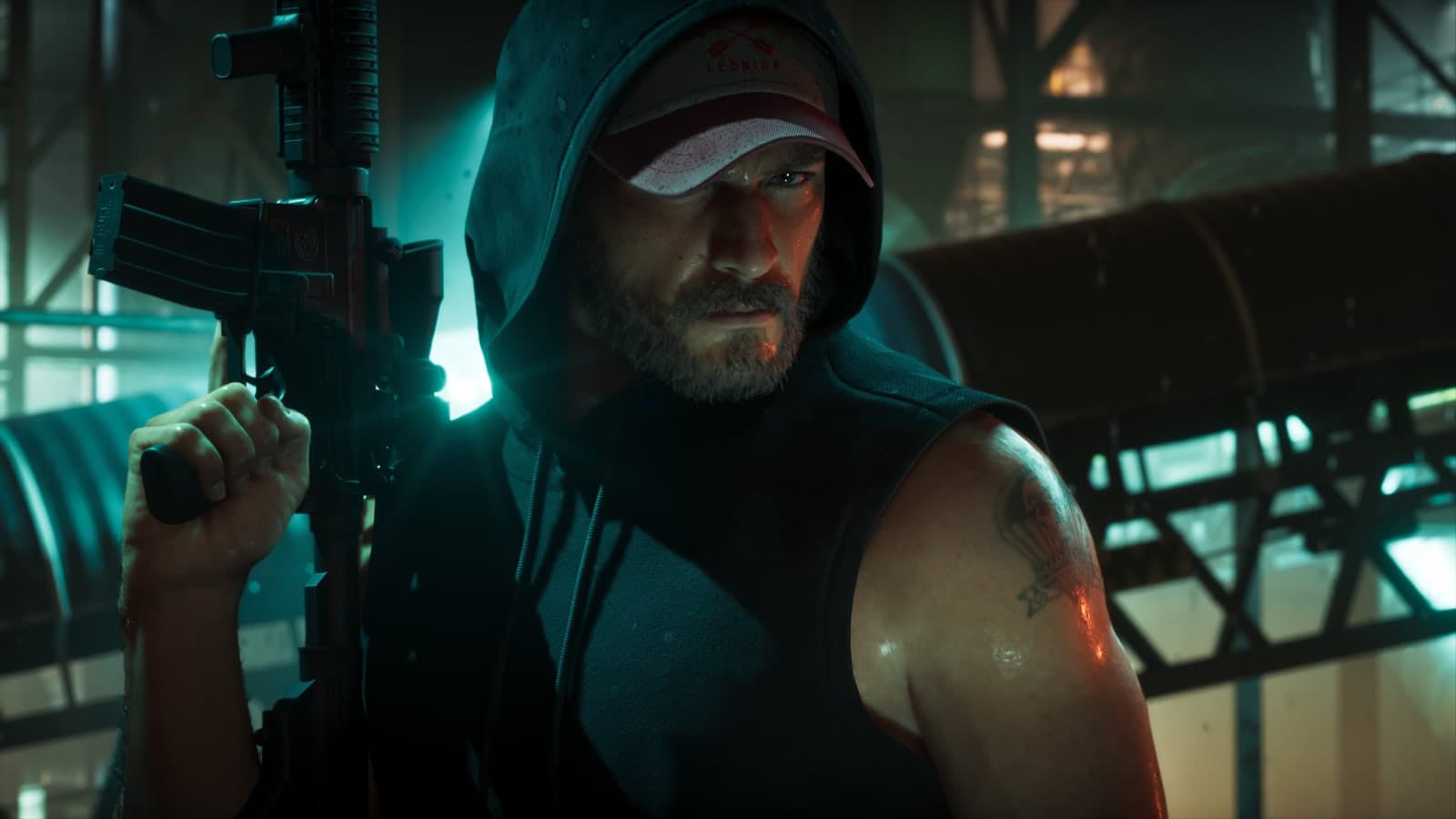 Jason in a hood and a cap holds a rifle in a dim industrial room