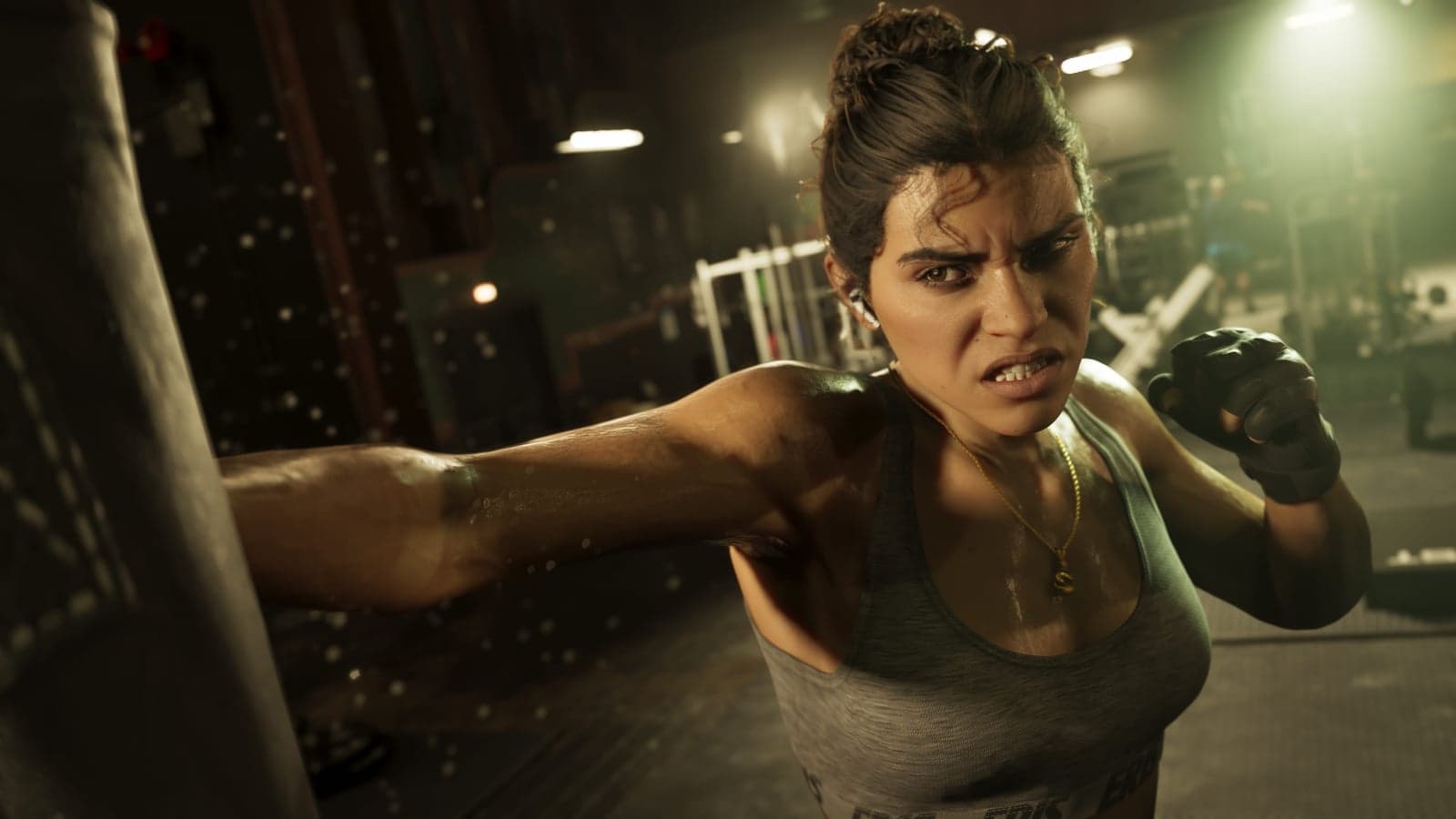 Lucia in boxing gloves throws a punch in a gym