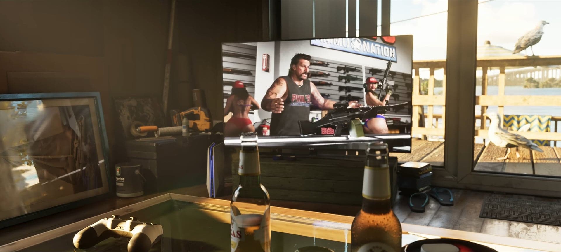 A TV in a room by the water showing an Ammu-Nation ad: a man in a Phil’s tank top with a machine gun on the counter