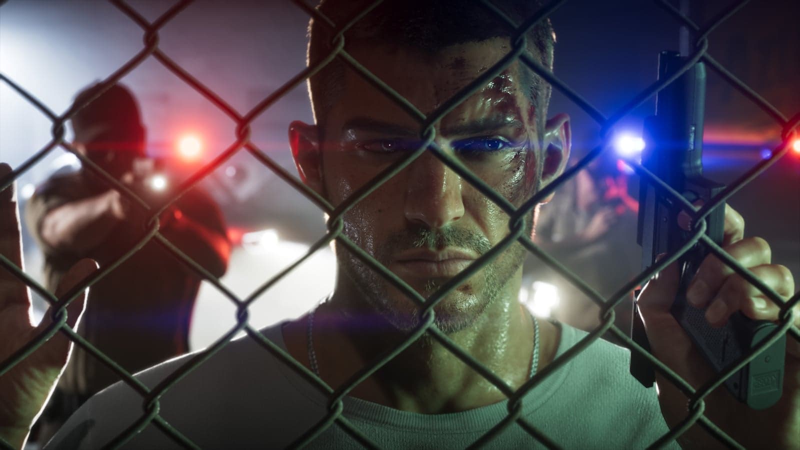 Jason with a bruised face behind a chain-link fence, lit by red and blue police lights