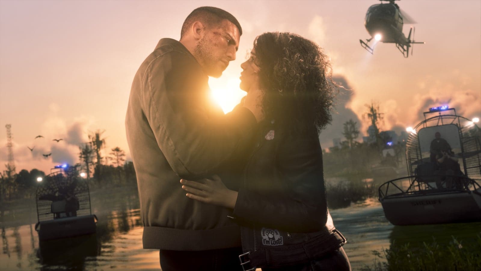 Jason and Lucia embrace at sunset in the Grassrivers wetlands, with police airboats behind them
