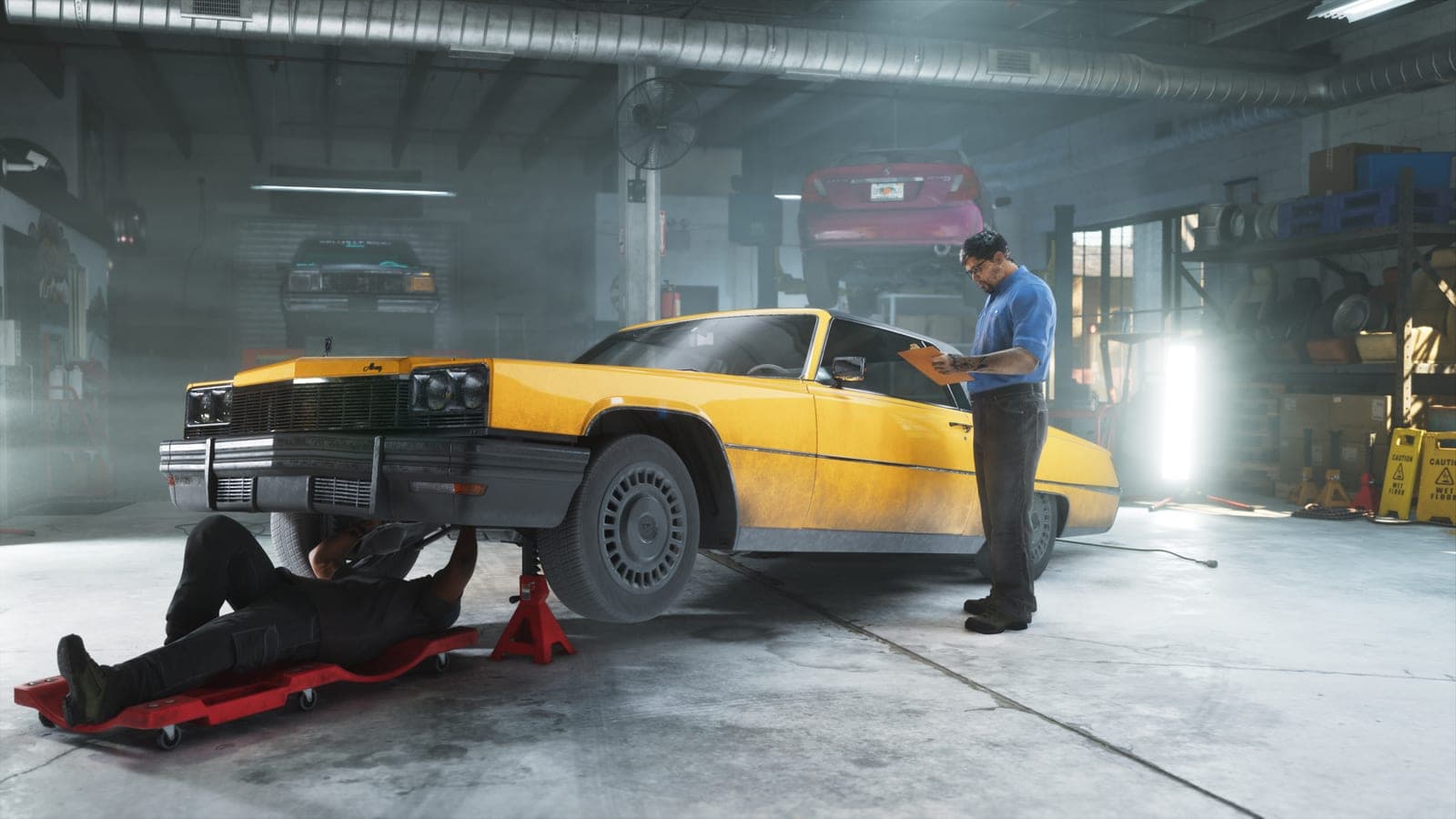 Mechanics at Rideout Customs work on a yellow sedan lifted on jacks
