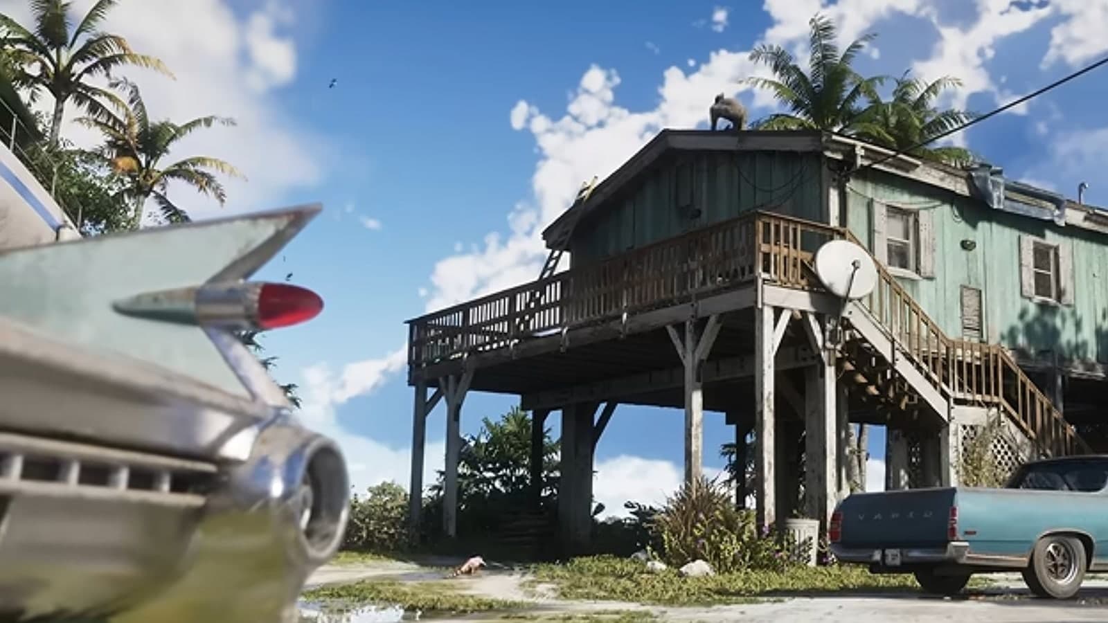 The tail fin and bullet taillights of a 1959-style coupe outside Jason’s stilt house